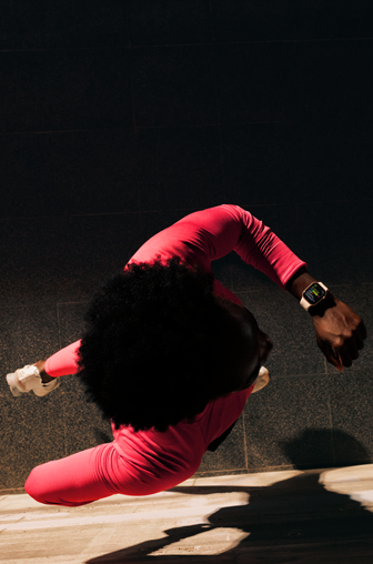 A person checks progress on Apple Watch Series 11 Workout app while running