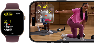 Apple Watch next to iPhone with Apple Fitness+ class on screen