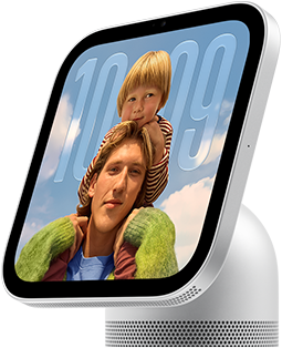 Apple HomeView, silver color, side exterior, semi-transparent time of day displayed on an image of a person carrying a child on shoulders, both looking forward