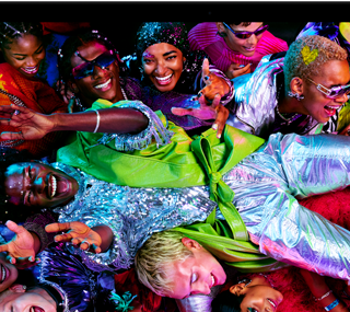 Colorful screen on a MacBook Pro of a person crowd-surfing at a party, showcasing the vibrant Liquid Retina XDR display