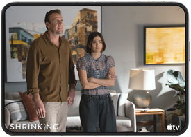 iPhone Duo, opened in horizontal position, Apple TV show "Shrinking" plays on screen